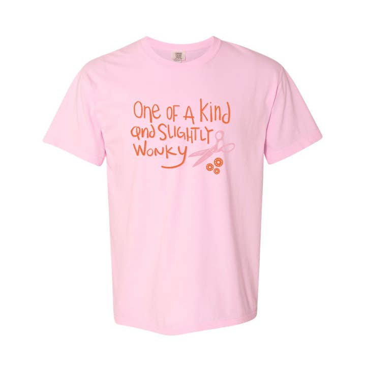 Pink t-shirt with orange text and graphic on a white background