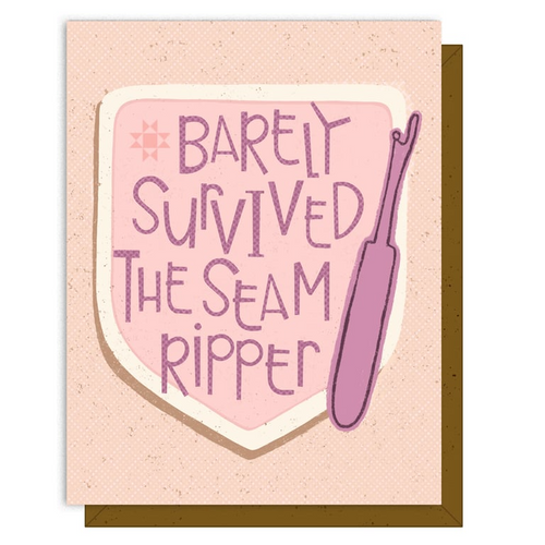 Card with text 'Barely Survived The Seam Ripper' and a purple seam ripper on a pink background