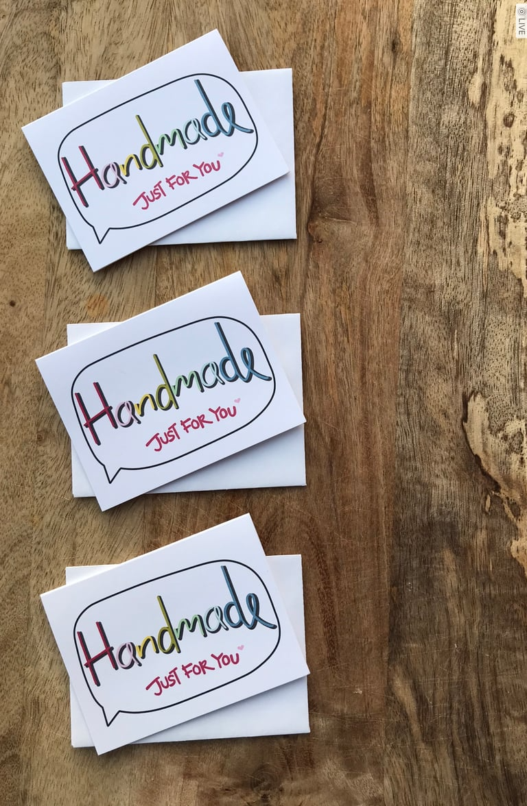 Three 'Handmade Just For You' cards on a wooden surface