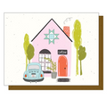 Illustration of a quilt shop with a pink building, blue car, and green trees on a white background.
