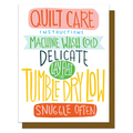 Card with colorful text on quilt care instructions against a white background