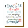 Birthday card with colorful text and a fabric roll illustration on a white background