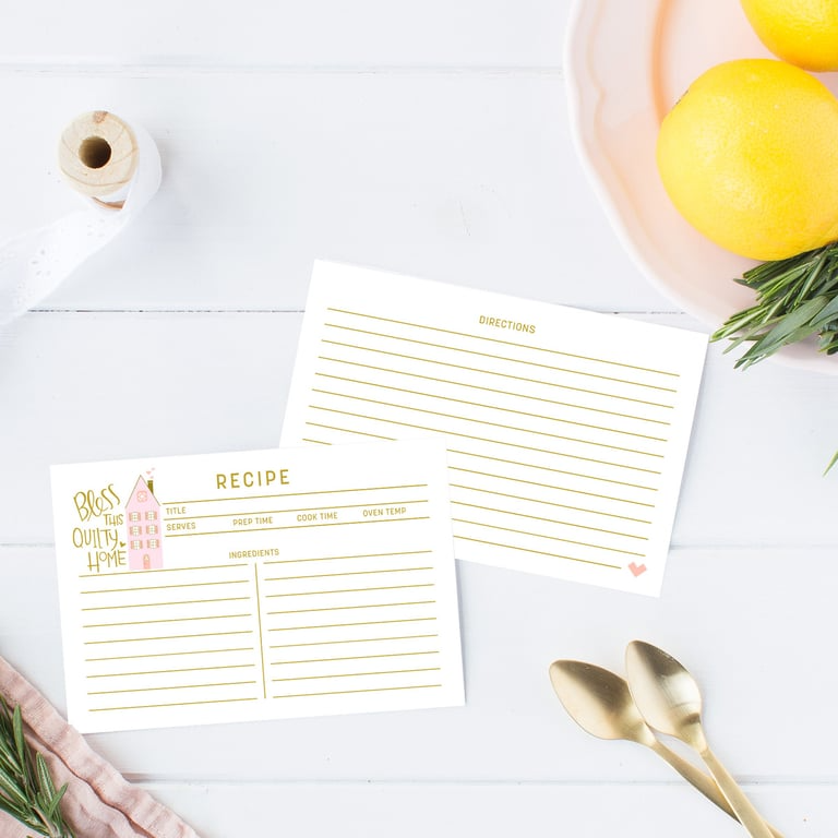 Two recipe cards on a white surface with lemons and spoons in the background.