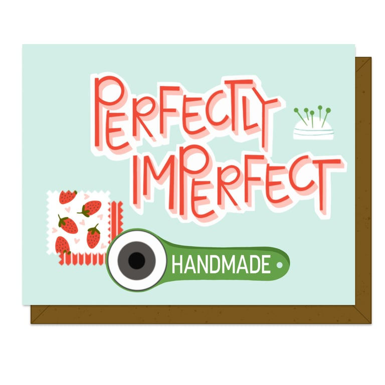 Card with 'Perfectly Imperfect' text and a stamp design on a light blue background