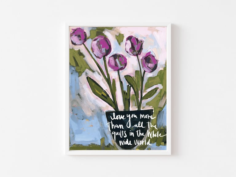Framed artwork with purple tulips and text on a white background