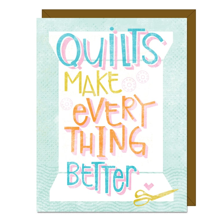 Card with colorful text 'Quilts make everything better' on a light blue background