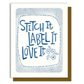 Card with 'Stitch It Label It Love It' text and floral designs on a white background