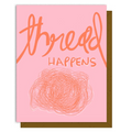 Card with 'thread happens' text and a ball of yarn illustration on a pink background