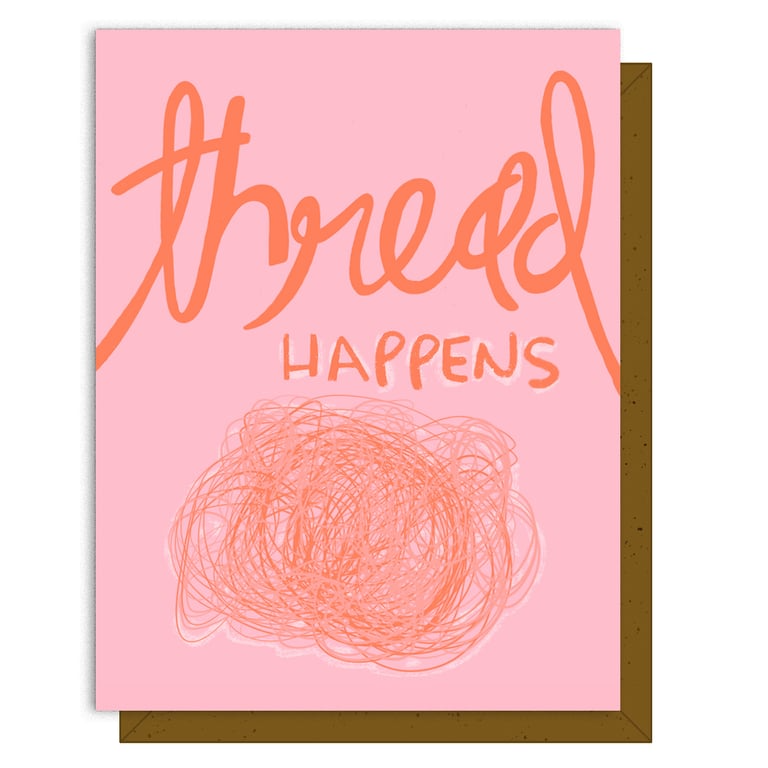 Card with 'thread happens' text and a ball of yarn illustration on a pink background