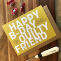 Greeting card with 'Happy B-Day to my favorite quilty friend' text on a wooden surface with sewing tools.