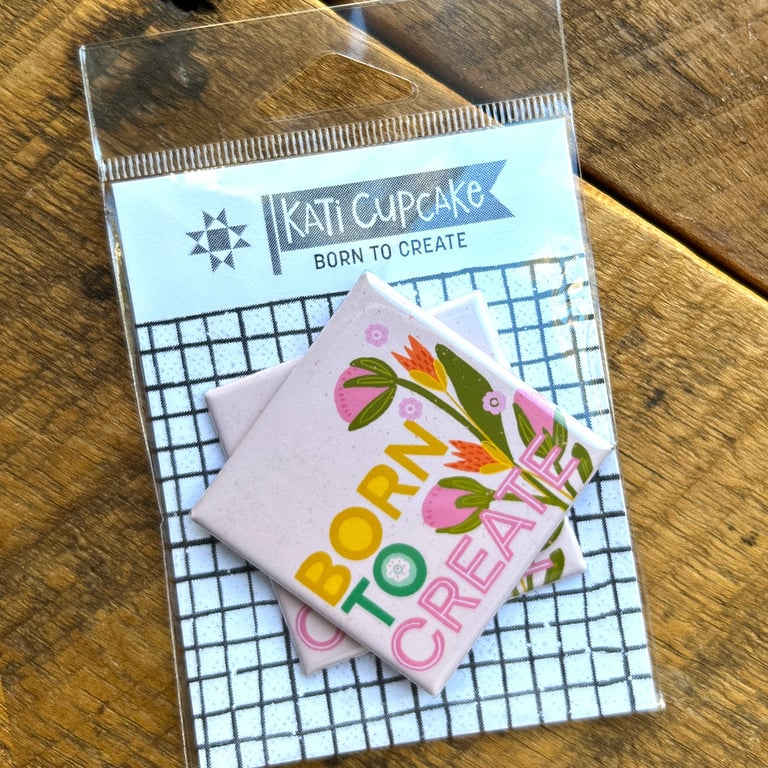 Packaged product with 'Kati Cupcake' branding on a wooden surface