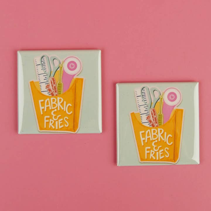 Two identical decorative magnets with 'Fabric & Fries' design on a pink background