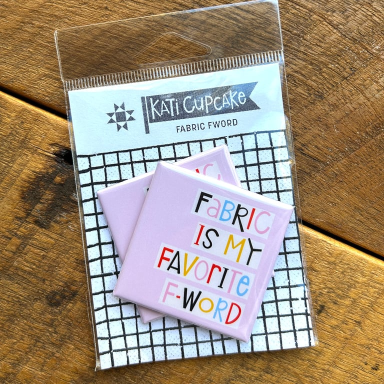 Kati Cupcake fabric swatches in packaging on a wooden surface