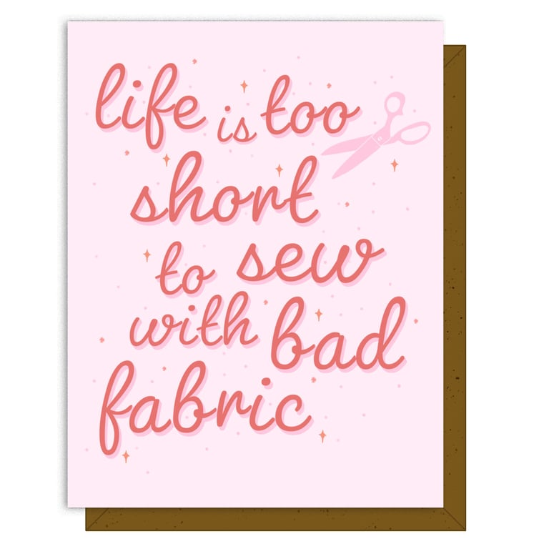 Card with motivational quote 'Life is too short to sew with bad fabric' on a pink background