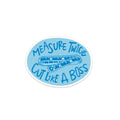 Blue oval sticker with a ruler graphic and text 'Measure Twice, Cut Like a Boss' on a white background