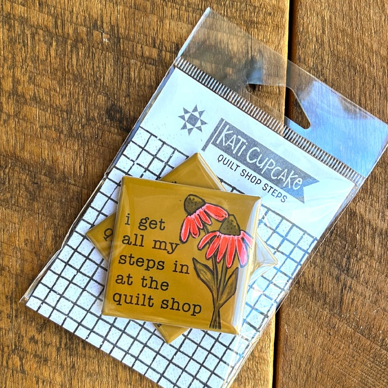 Decorative coaster with floral design and text on a clear packaging with 'Kati Cupcake' branding.